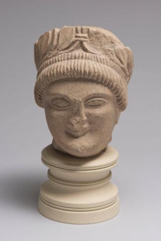 Head of Beardless Male Votary with Laurel Wreath