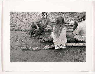 Woodstock (Three People Conversing in Mud Puddle)