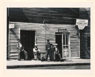 Vicksburg Negroes and shop front. Mississippi