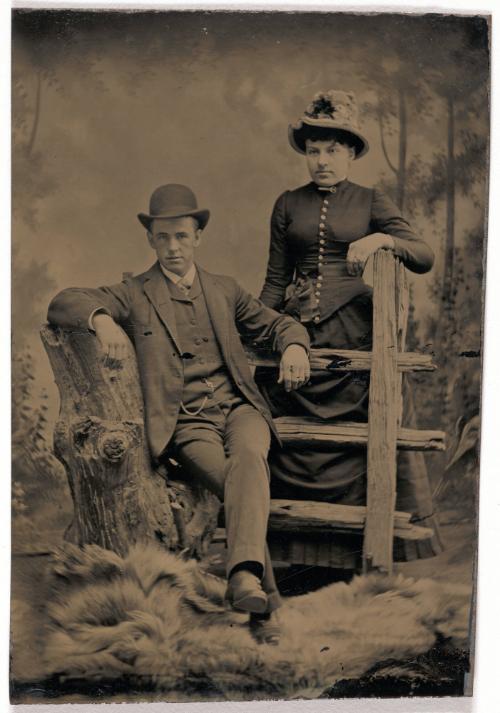 Portrait of a Couple by a Fence