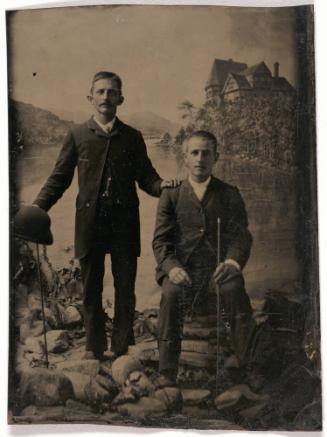 Portrait of Two Hikers before an Alpine Lake Backdrop