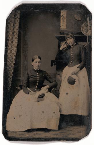 Portrait of Two Women in Matching Dresses