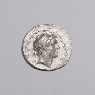 Tetradrachm: Diademed Head Right Within Laurel-Wreath; Tyche Seated Left, on Throne Supported by Winged Monster, Holding Baton and Cornucopiae, Monogram Left in Field on Reverse