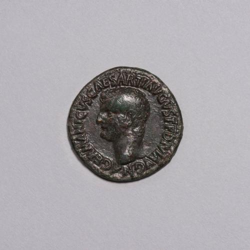 As: Bare Head of Germanicus Left; S.C. on Either Side of Neptune, Standing Left, Holding Dolphin and Trident on Reverse