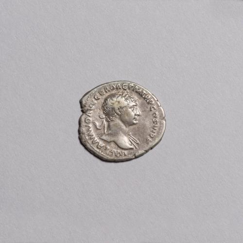 Trajan Denarius (Obverse: Laureate Bust of Trajan Facing Right with Drapery on Far Shoulder; Reverse: Equestrian Statue of Trajan Facing Left Holding Spear and Sword)