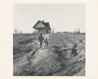 Negro children and old home on badly eroded land near Wadesboro, North Carolina