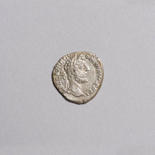 Denarius: Laureate Head of Commodus Right; Pietas Seated Left on Throne, Extending Hand to Child and Holding Scepter, Star in Field Left on Reverse