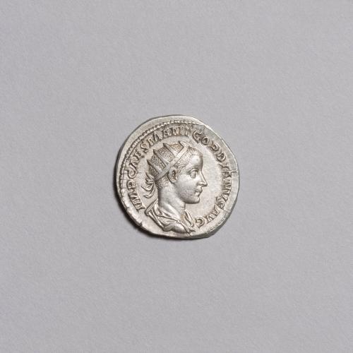 Antoninianus: Laureate Radiate Bust of Gordian III Draped and Cuirassed Right; Jupiter Standing Facing, Head Right, Holding Scepter and Thunderbolts, Small Gordian Standing Left at Feet Gathering up Robe on Reverse