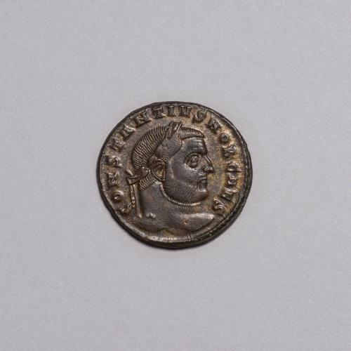 Follis: Laureate Head of Constantius I Right; Moneta Standing Left, Holding Scales and Cornucopiae, T.T. in Exergue on Reverse