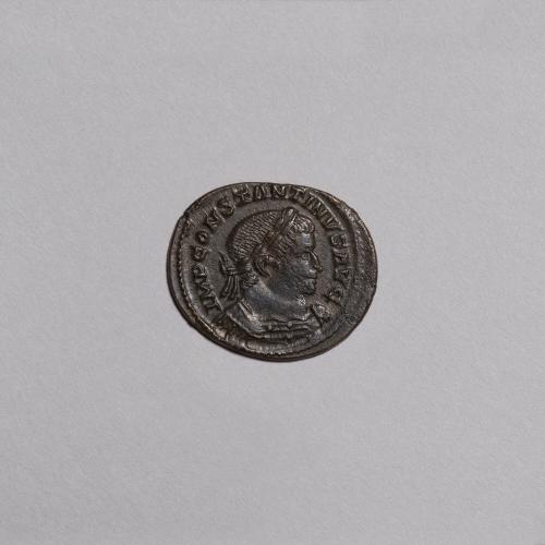 Follis: Laureate and Cuirassed Bust of Constantine I Right; Sol Standing Nude Left, Radiate Crown, Left Shoulder Draped, Holding Globe, PTR in Exergue, T - F in Field on Reverse