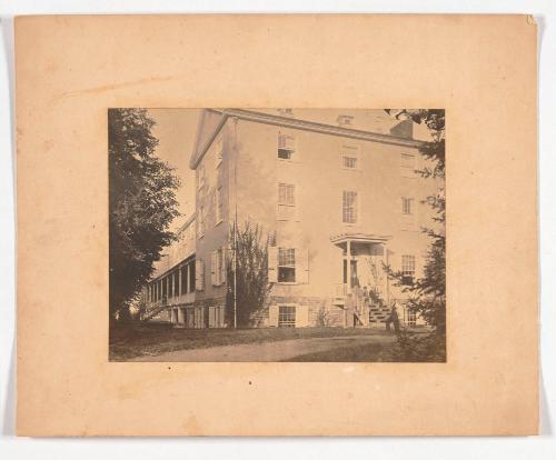 Men Seated on the Steps of a Building