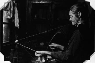 Mrs. James Watson Spinning Yarn in her Tennessee Cabin