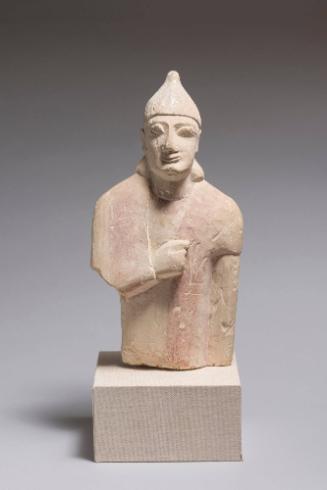 Male Votary with Conical Helmet, Tunic, and Mantle