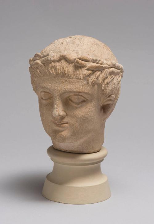 Head of Beardless Male Votary with Laurel Wreath