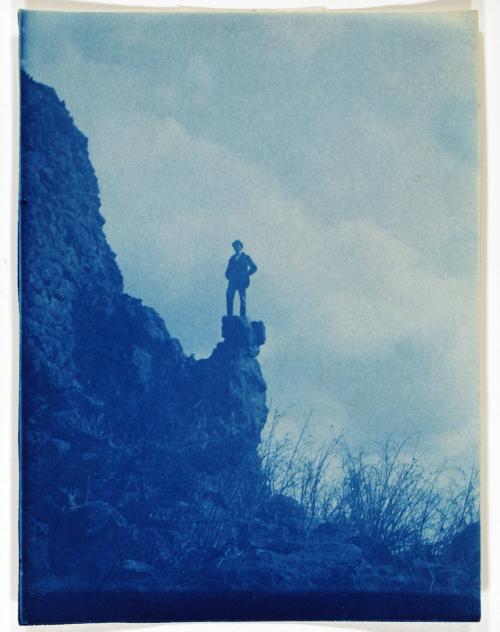 Man Standing on Rock