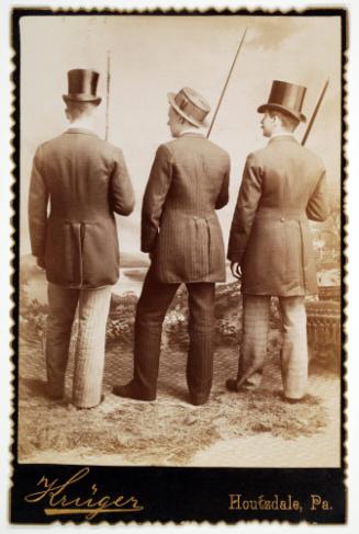 A Group of Three Men Turning Their Backs to a Camera