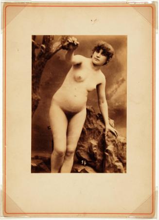 Female Nude Posed between a Tree and a Rock