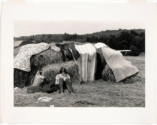 Woodstock (Girl Sitting in Front of Hay Bale Hut)